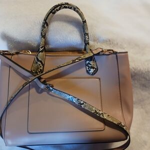 Elegant Pink Handbag with Snake Print Accents